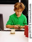 Boy counting currency notes