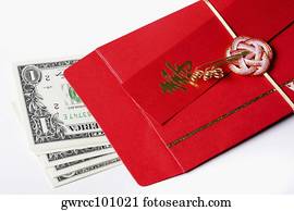 Close-up of US paper currency with a red envelope