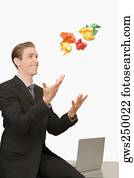 Businessman throwing crumpled papers