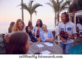 Friends at party by beach, Plettenberg Bay, Western Cape, South Africa