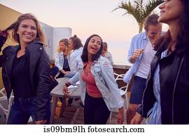 Friends at party by beach, Plettenberg Bay, Western Cape, South Africa
