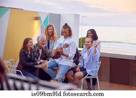 Friends at party by beach, Plettenberg Bay, Western Cape, South Africa