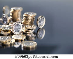 Pile of new British one pound coins, close-up