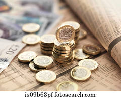 Still life of British currency on financial newspaper, close-up