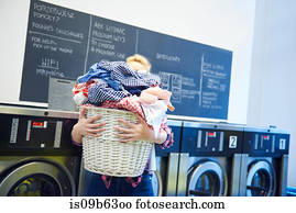 Piles of clean laundry and washing powder Stock Image  is098yz0b