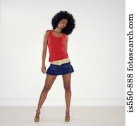 Full length portrait of woman with afro
