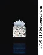 Cityscape seen through arched window