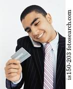 Businessman with mobile and credit card
