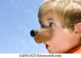 A boy wearing an animal nose