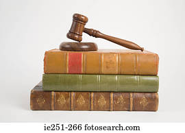 A gavel on top of books