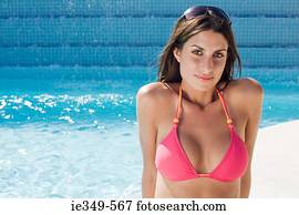 Woman by swimming pool
