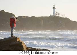 A man photographing the sea
