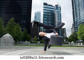 Businessman practising capoeira