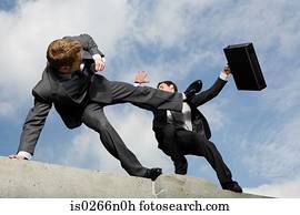 Businessmen fighting