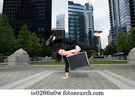 Businesswoman practising capoeira