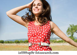 Carefree young woman in rural scene