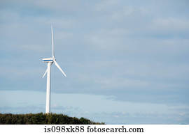 Wind turbine against blue sky