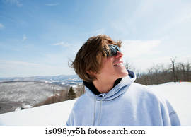 Young man wearing hooded top looking away