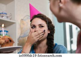 Young woman wearing party hat