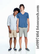 Gay couple standing against white background