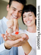 Couple holding model house