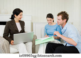 Couple meeting financial advisor at home
