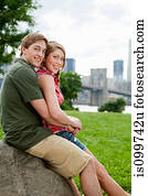 Portrait of young couple in city park