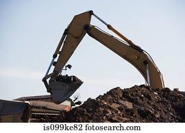 Earth mover and pile of rubble
