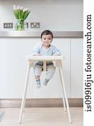 Baby boy in his high chair