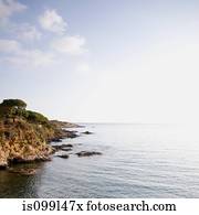 Coast and rocks tumbling into the sea, Costa Brava, Spain