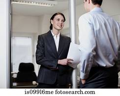 Colleagues talking in office