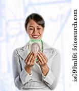 Woman looking at image on screen of her daughter