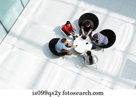 Overhead view of colleagues in meeting