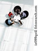 Overhead view of colleagues in meeting