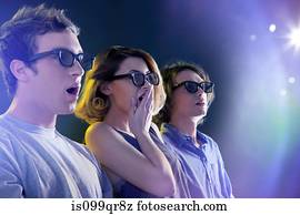 People in 3D glasses looking towards light