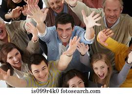 Group of people with arms raised, high angle