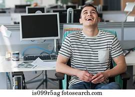 Man laughing in office
