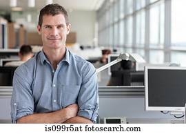 Portrait of man with arms folded