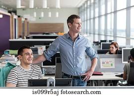 Two colleagues in office interior