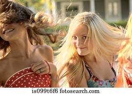 Girls with long hair in sunlight