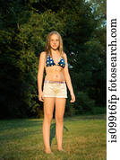 Portrait of girl wearing bikini top and shorts