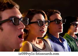 Row of people watching 3D movie