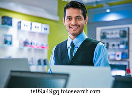 Salesman smiling in store