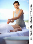 Woman giving salt scrub outdoors