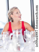 Woman having dinner at restaurant