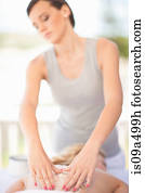 Woman having salt scrub on beach