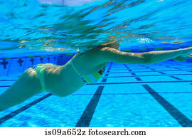 Pregnant woman swimming in pool