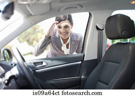 Woman examining new car