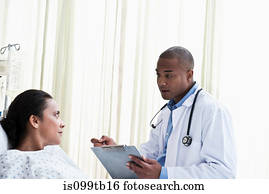 Doctor talking to patient in hospital