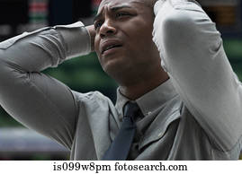 Stressed businessman at stock exchange